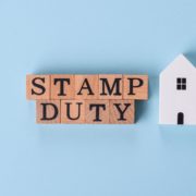 Image of text with wooden letters stating stamp duty