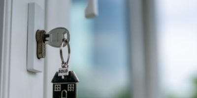 Key in the door with a house keyring
